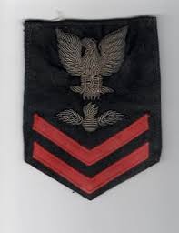 His rank Aviation Ordnance Man Second Class